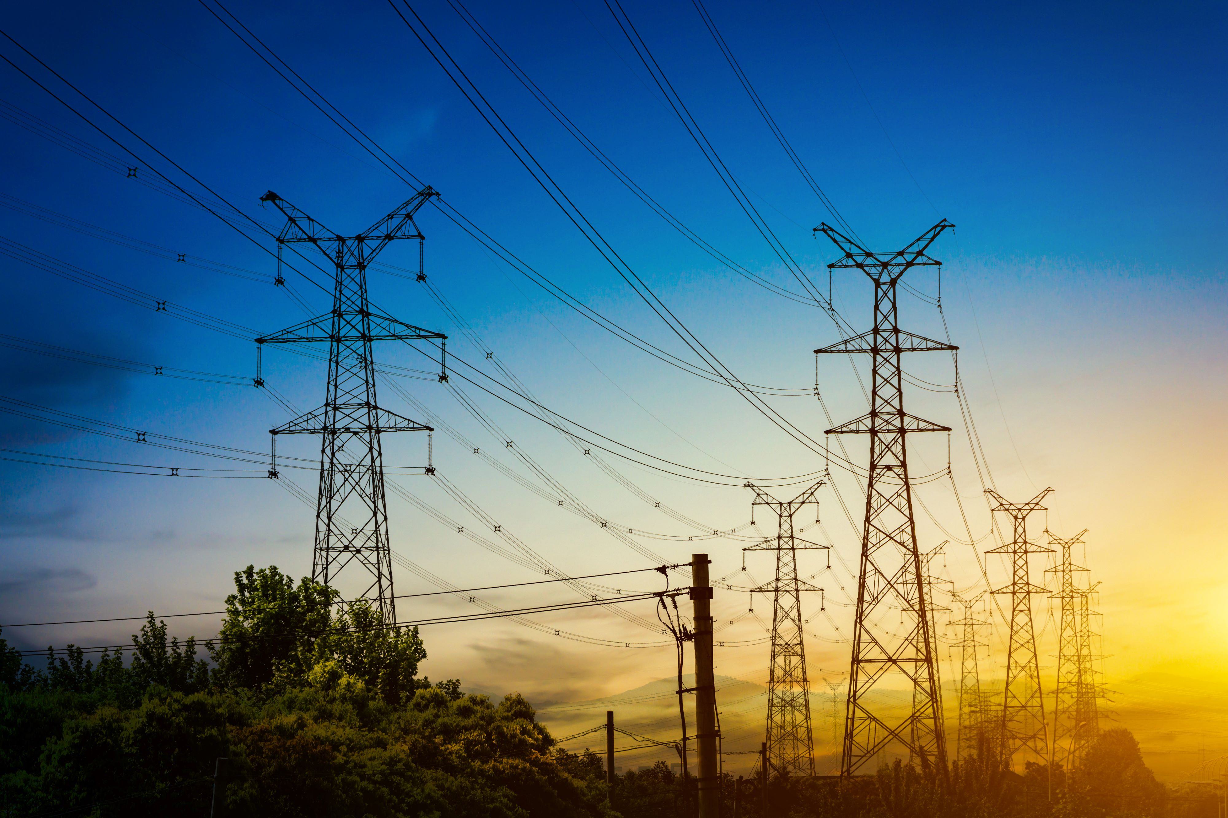 power lines with setting sun in background